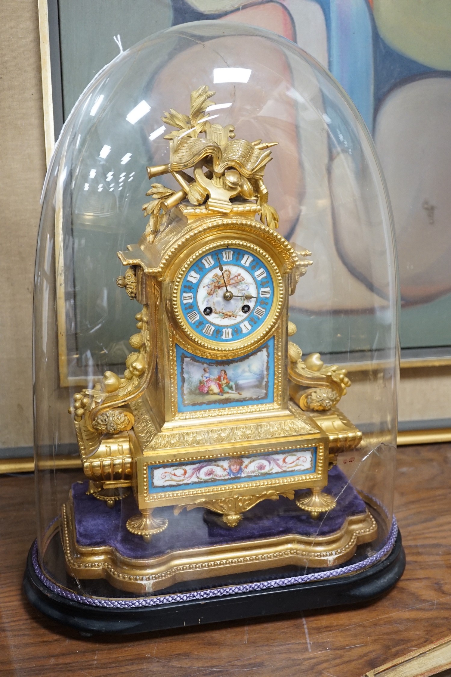 A late 19th century French ormolu and Serves style porcelain mounted mantel clock